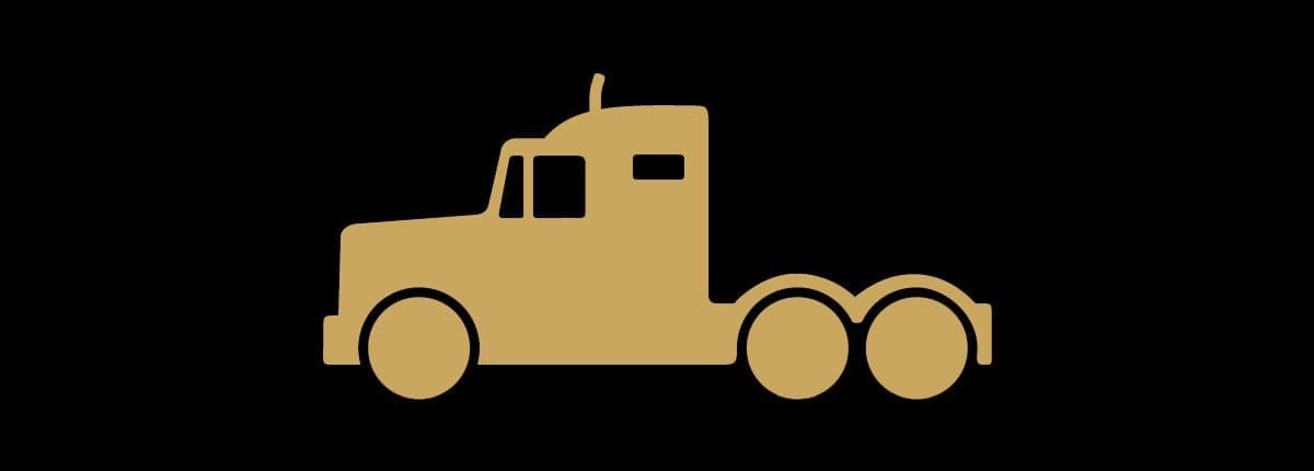 Gold silhouette of a semi-truck on a black background, highlighting the strength and reliability synonymous with the Asset Valuations Group.